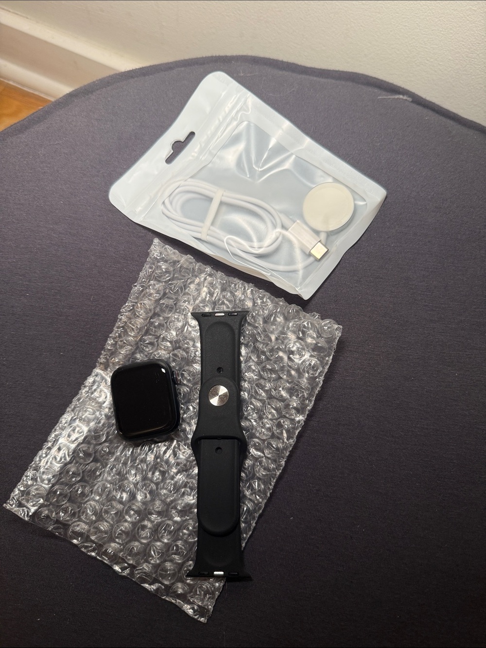 Apple Black Smartwatch with Black Silicone Band and Magnetic Charger Cable